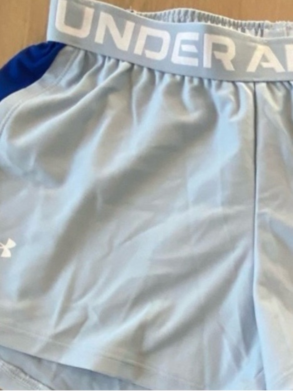 New Under Armour Women’s Light Blue Performance Shorts.